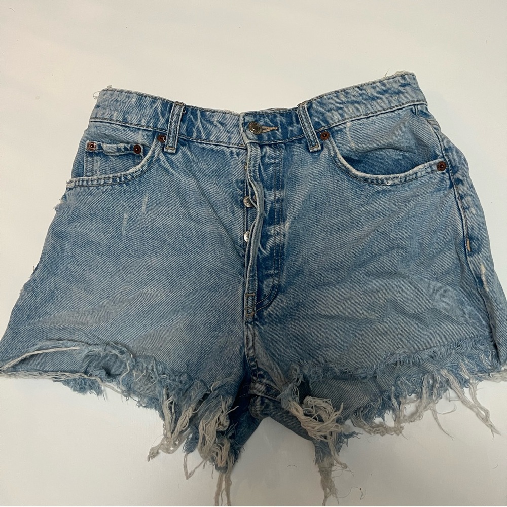 Distressed high-waisted denim shorts